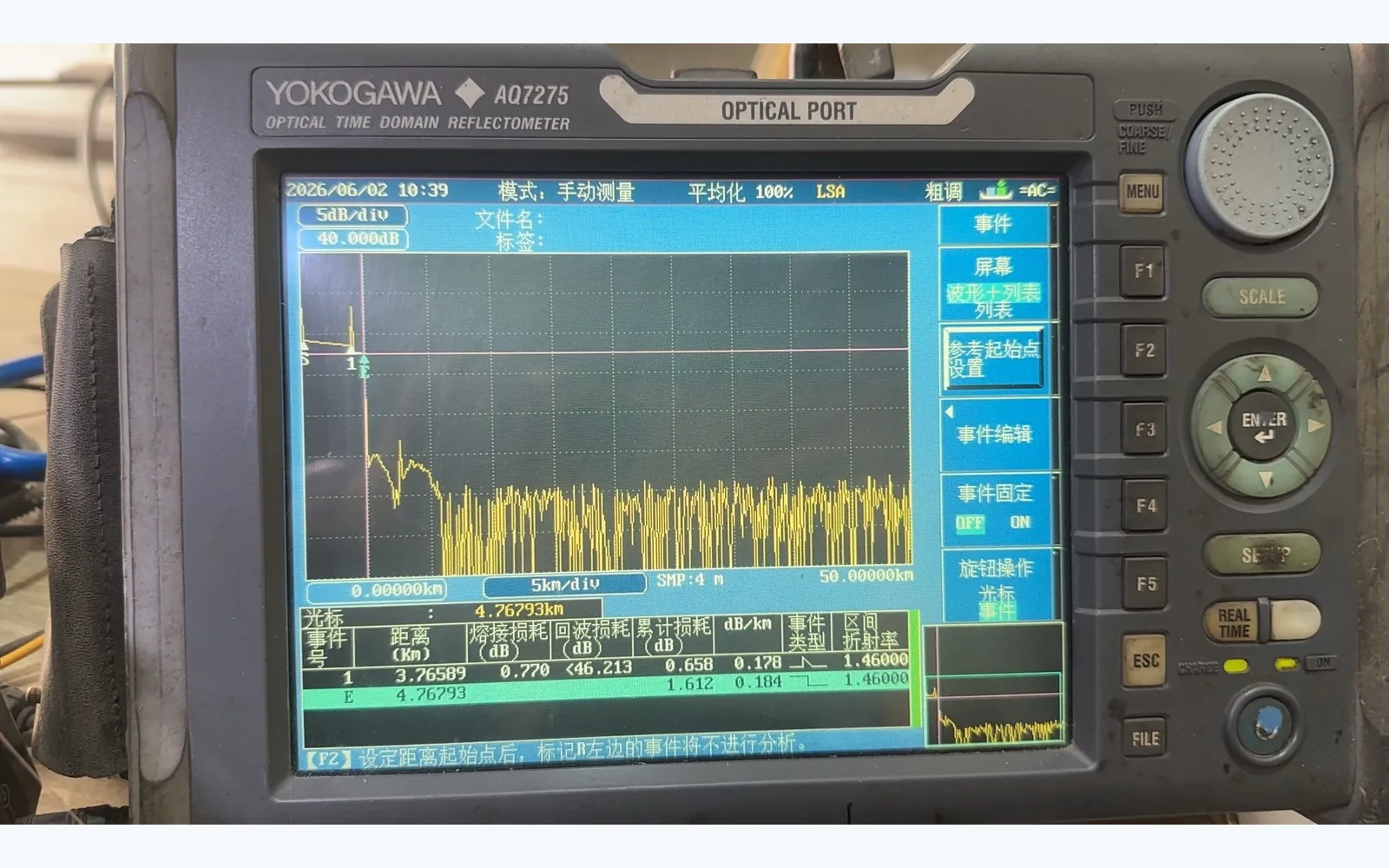 Optical time domain reflectometer displaying a trace, used as an instrument example and not as evidence of a passing test or an accepted customer project